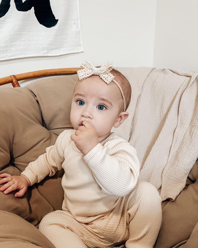 Baby girl wearing a neutral matching set