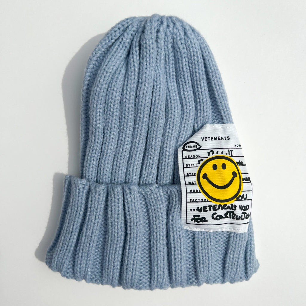 Smiley ribbed beanie in baby blue